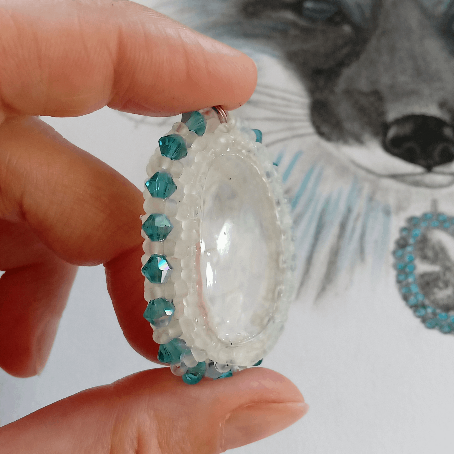 One-of-a-Kind rock crystal pendant in the hand