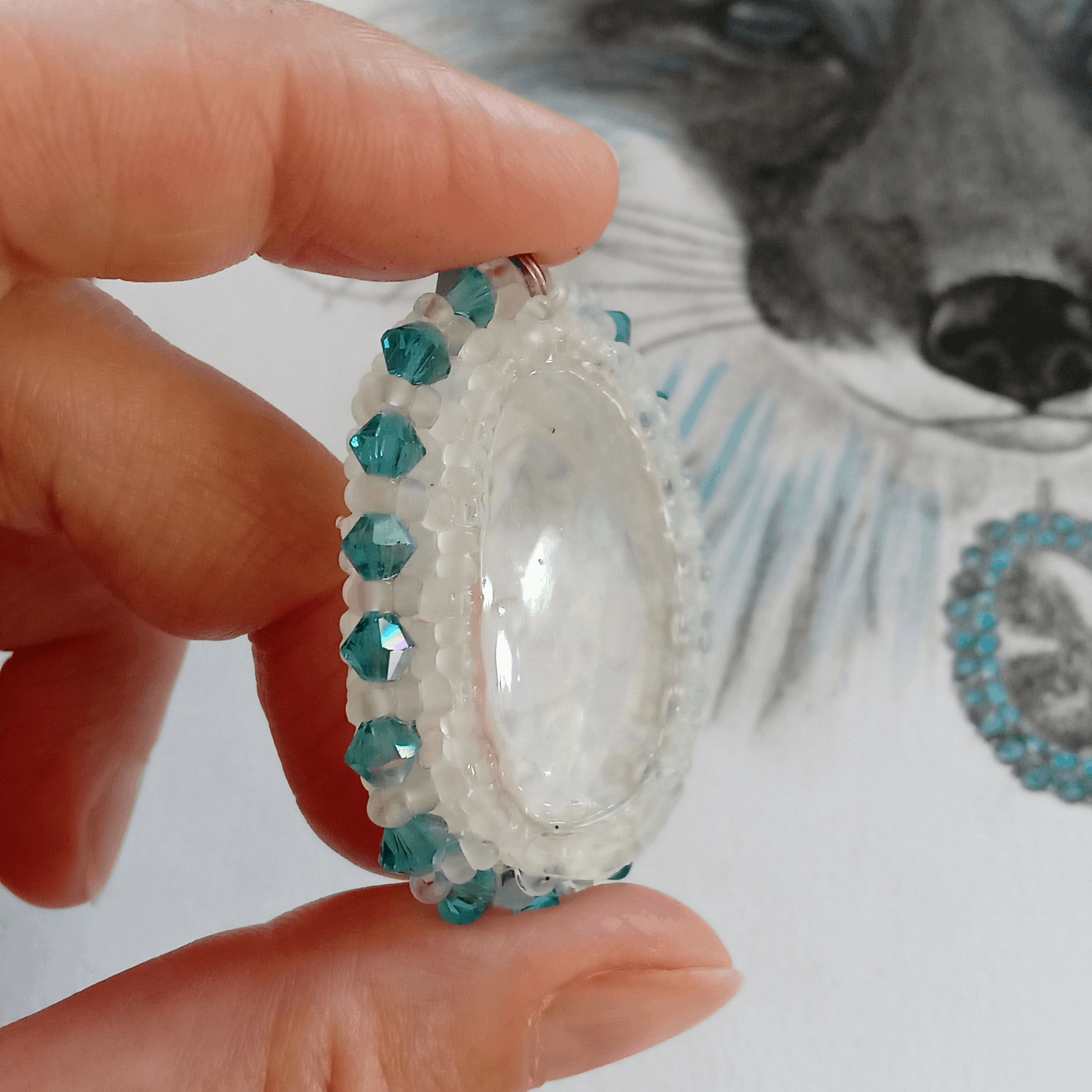 One-of-a-Kind rock crystal pendant in the hand