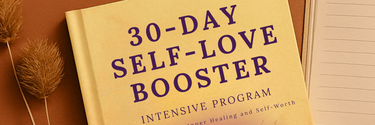 Book titled '30-Day Self-Love Booster' on a wooden surface with a pen and dried plant.
