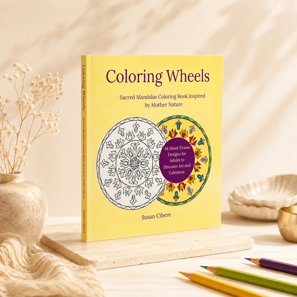 Coloring Wheels sacred mandala coloring book mockup with hand-drawn nature-inspired mandala designs, colored pencils, and soft neutral styling for a calming creative ritual.