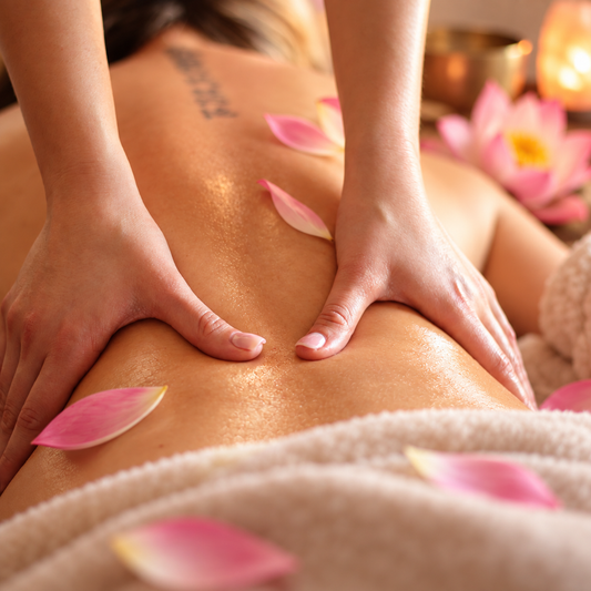 Relaxing Pink Lotus Feminine Balance Massage Ritual at Energetic Beauty Budapest, featuring a soothing back massage with warm body oil, lotus petals and a luxurious spa atmosphere for women.
